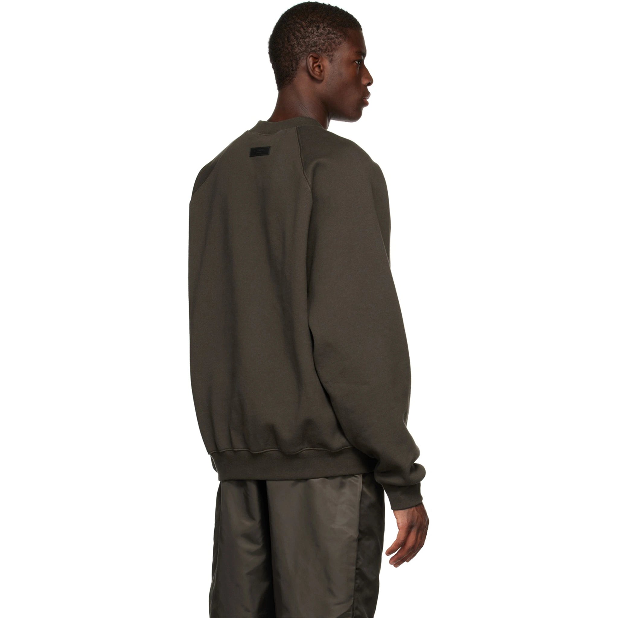 Model back view of Fear Of God Essentials Off Black Sweatshirt (SS23) 192BT222040F